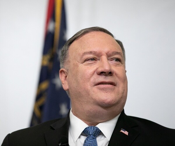 mike pompeo stands in classroom