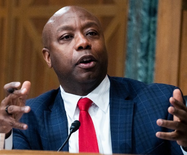 tim scott gestures as he speaks