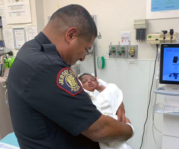 NJ Police Officer Catches Baby Thrown From a Second-Floor Balcony