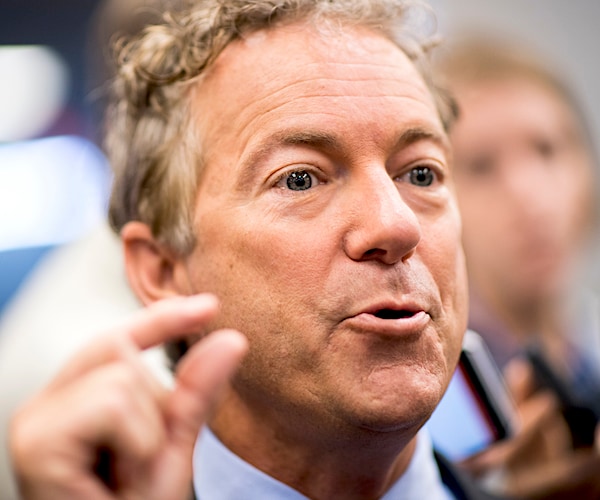 rand paul points as he speaks during a contentious senate committee hearing