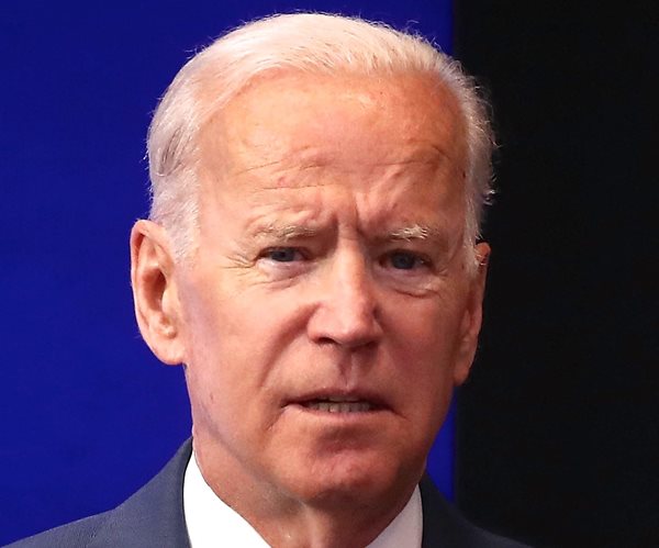 joe biden has a serious expression in headshot