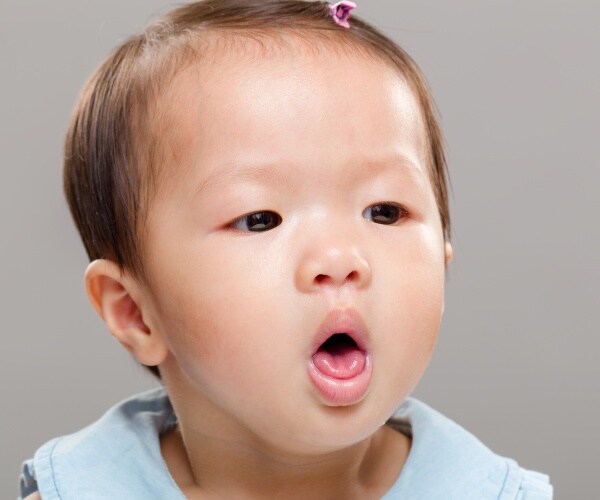 young toddler girl coughing