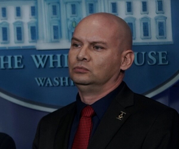 art del cueto stands in press briefing room