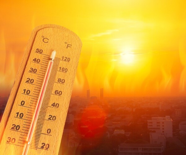 sun and high heat over a city, thermometer showing temperatures over 100 degrees Fahrenheit