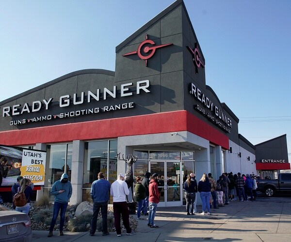 people line up in front of gun store