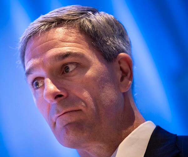 ken cuccinelli listens to speakers at a naturalization ceremony