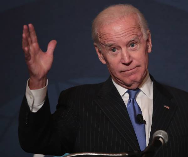 biden gestures while making a speech