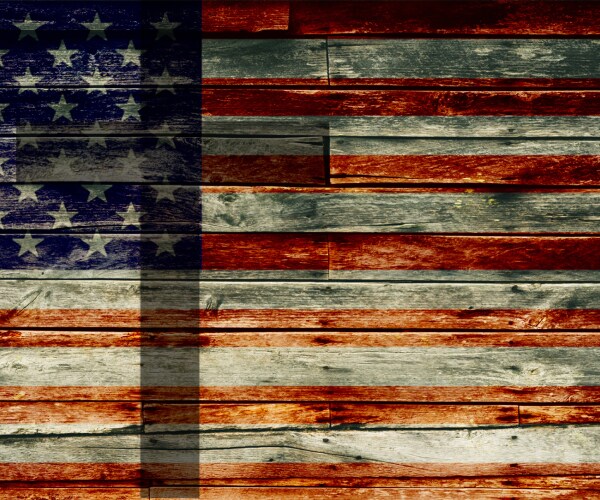 an american flag with a cross superimposed on it