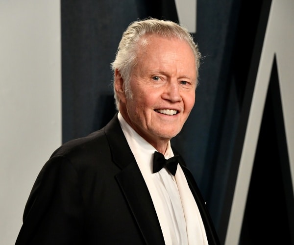 jon voight poses in a tux