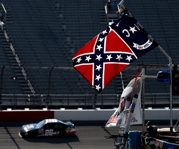 a confederate flag flies at nascar