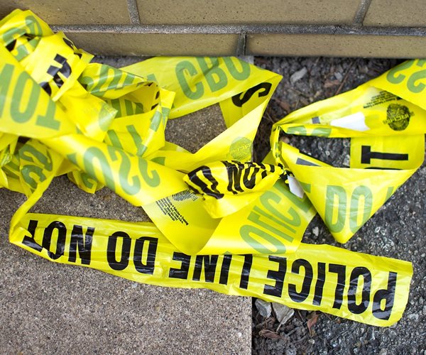 crime scene tape piled on the ground