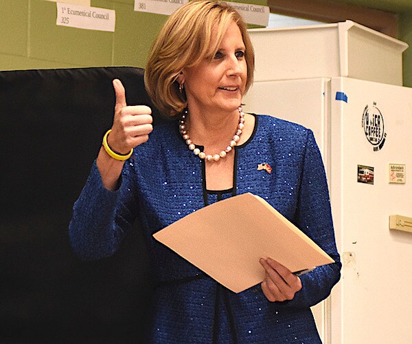 new york republican representative claudia tenney gives a thumbs up while holding her ballot at her polling place