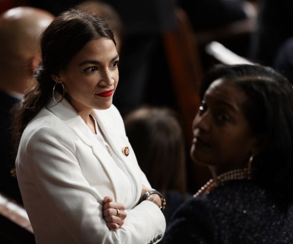 alexandria ocasio-cortez stands with and rep. jahana hayes on the house floor.