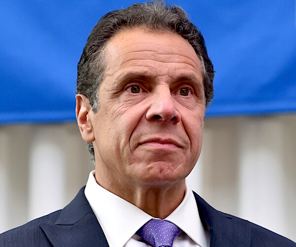 new york governor andrew cuomo stands stoically