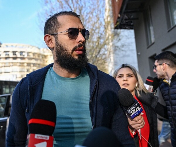 andrew tate attends a hearing