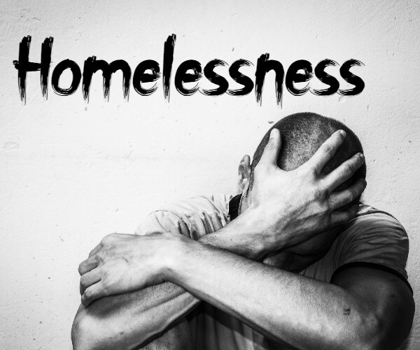 a man with his head in his hands and theword homelessness written over him