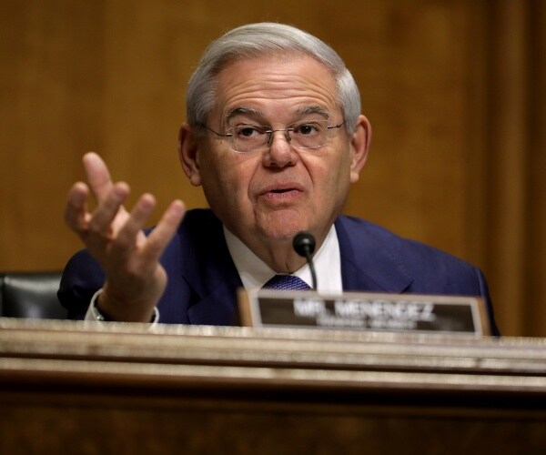 menendez in a navy blue suit and blue tie 