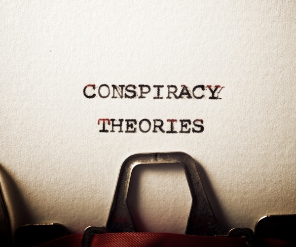 conspiracy theories phrase written with a typewriter