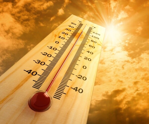 thermometer against sunny, hot sky showing temps near 100 degrees F