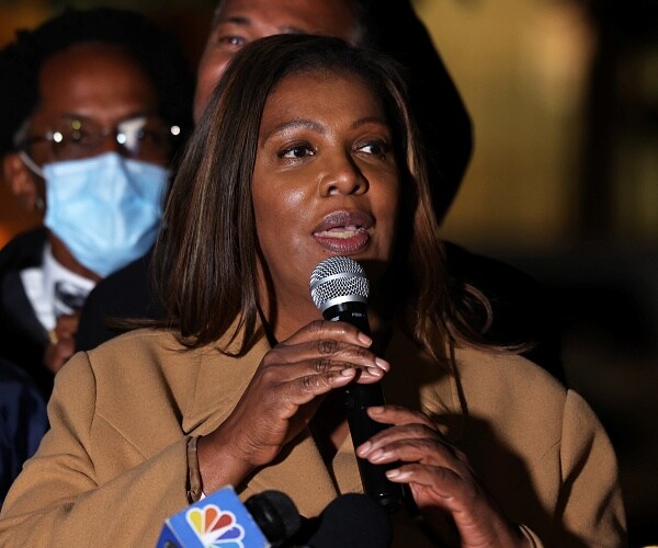 letitia james speaks into mic outside