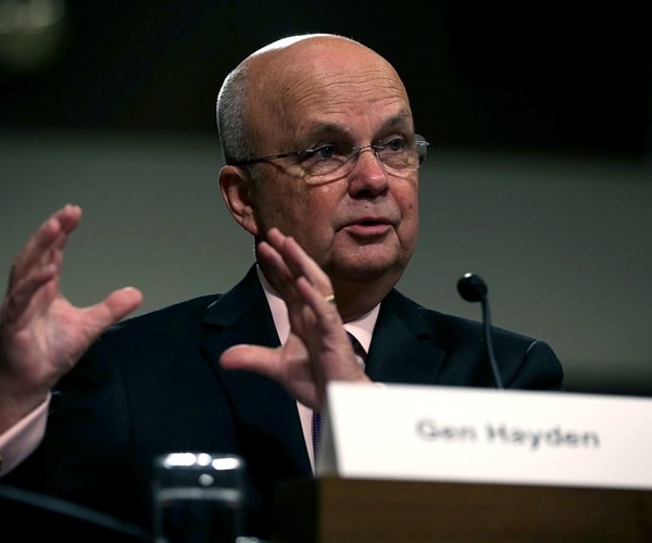 michael hayden sits at a table and speaks before congress