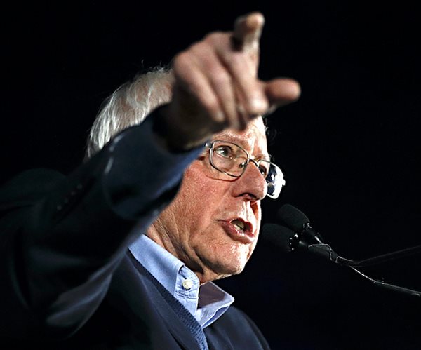 bernie sanders gestures during a news conference