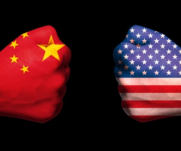 opposing boxing gloves with china and american flag motifs