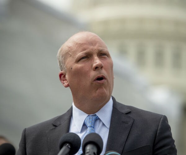 rep. chip roy is shown doing a news conference