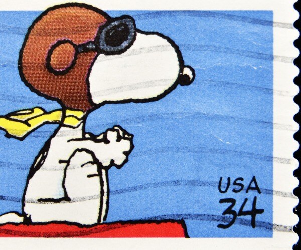 Snoopy prepares to engage the Red Baron in a postage-stamp depiction of the beloved beagle