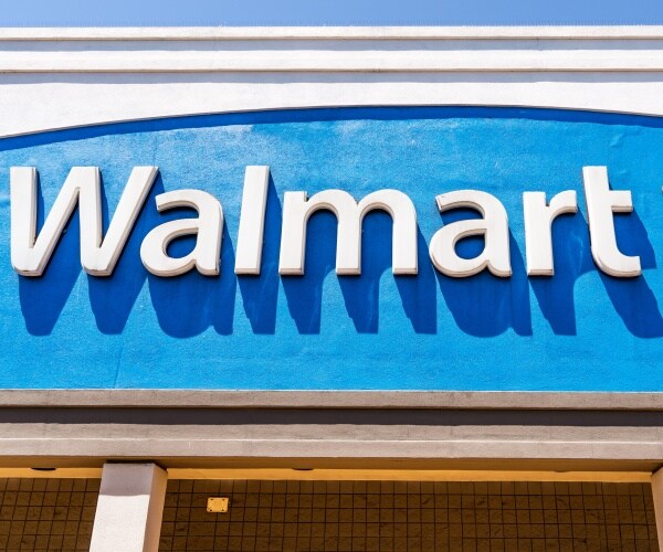 the walmart logo displayed on the facade of a building