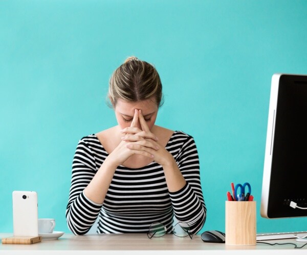 woman feeling anxiety at work