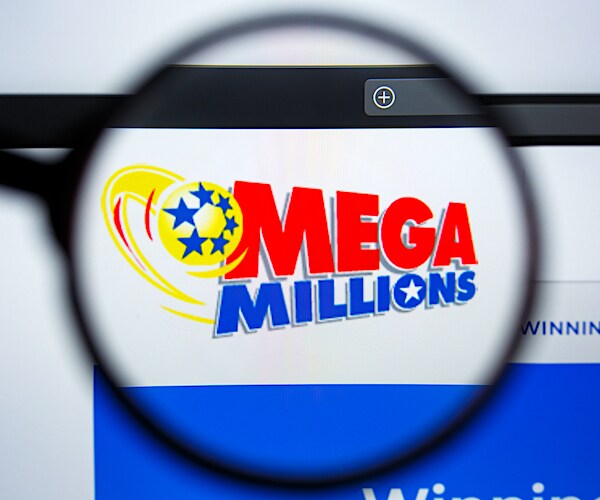 the mega millions logo behind a magnifying glass