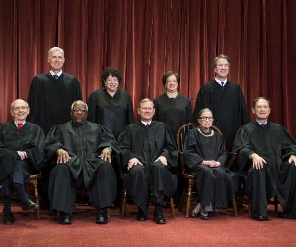 the supreme court justices are shown in their black robes