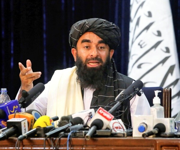 Taliban spokesman Zabihullah Mujahid at a press conference.