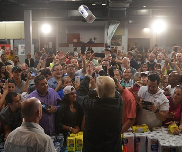 president donald trump throw paper towel to residents in puerto rico