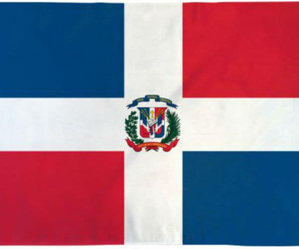 dominican republic's flag shown with blue and red squares and emblem in the center