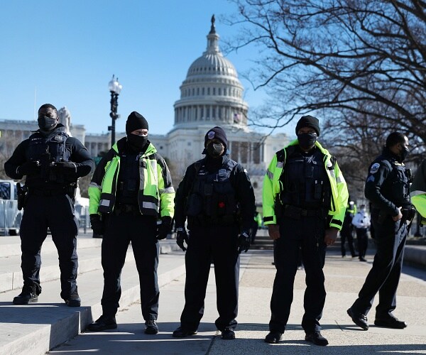 police officers stand with us capitol in background