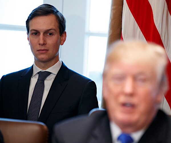 jared kushner sits off the right shoulder of president donald trump off the cabinet table in the situation room