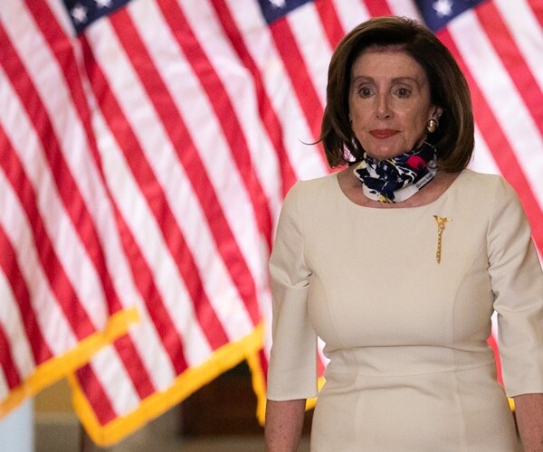 nancy pelosi arrives with scarf on neck