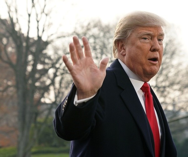 trump waving to the camera outside