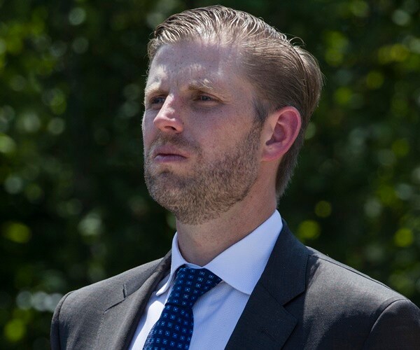 eric trump stands at attention