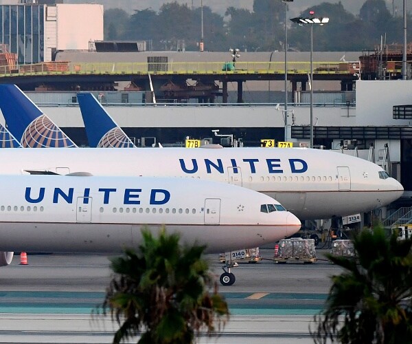 united airlines planes lined up at airport