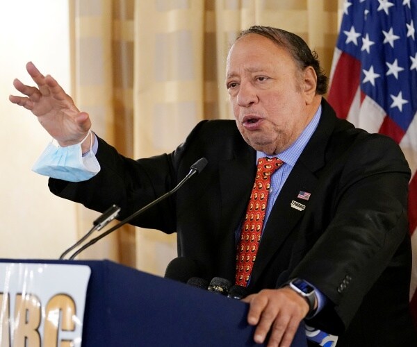 john catsimatidis speaks at a lectern.