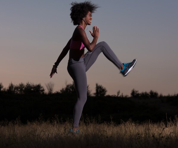 woman working out outside in evening