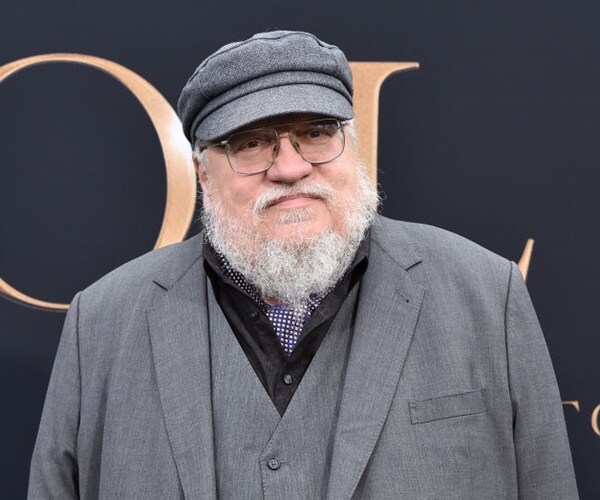 george r.r. martin poses for a picture at a screening of "tolkien."