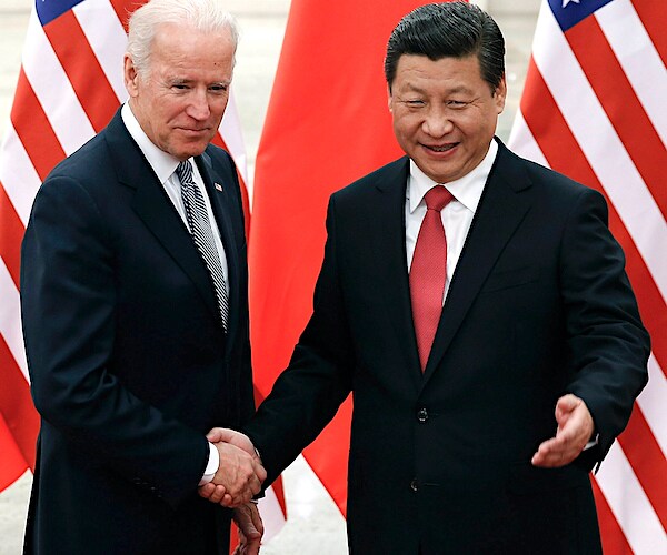 Joe Biden and Chinese President Xi Jinping interact during the obama administration