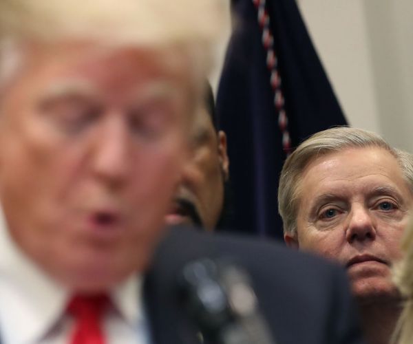 sen. lindsey graham listens to president donald trump make an announcement regarding the 'first step act' bill.