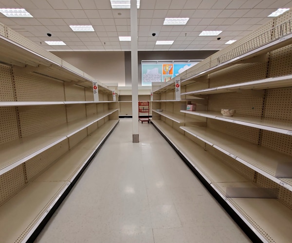 an empty aisle of paper products at a target store