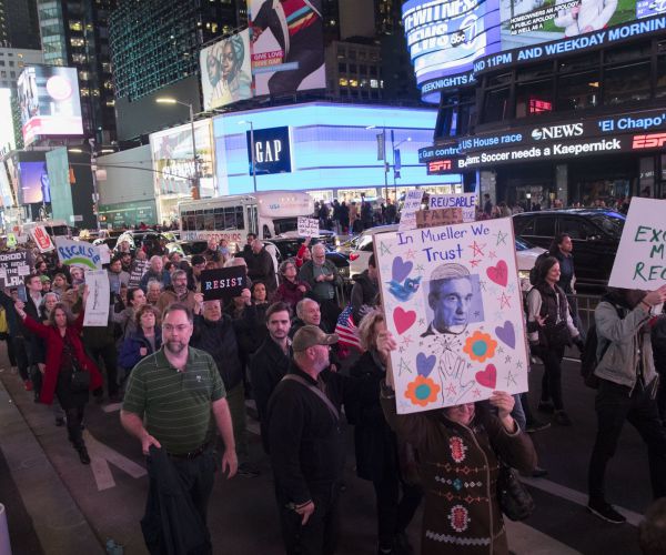 protesters march through times square during a demonstration in support of special counsel robert mueller. 