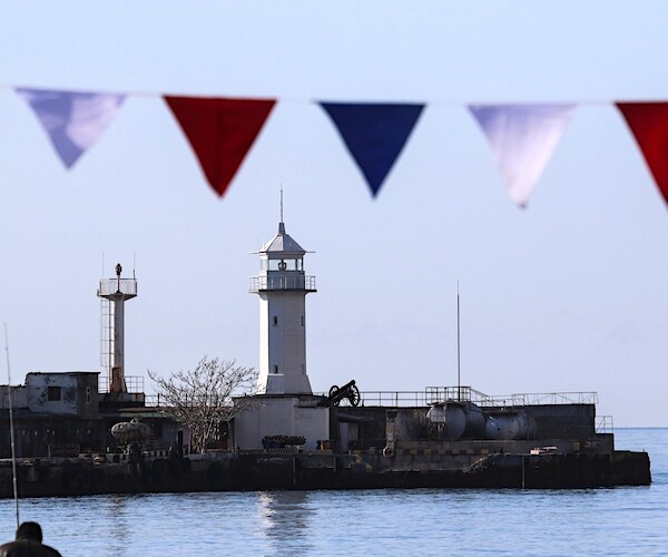 A lighthouse is pictured behind decorations as crimea marks the fifth anniversary of the referendum on it status